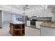Well-lit kitchen with white cabinetry, stainless steel appliances, and granite countertops at 4311 52Nd E St, Bradenton, FL 34208