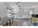 Bright kitchen with clean white cabinets and a cozy dining area at 4311 52Nd E St, Bradenton, FL 34208