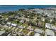 This aerial view showcases the neighborhood homes, yard, and pool at 4420 101St W St, Bradenton, FL 34210