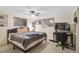 Comfortable bedroom with a ceiling fan, natural light, and space for a home office at 4420 101St W St, Bradenton, FL 34210