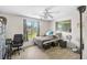 Bedroom featuring natural light from windows and a ceiling fan for climate control at 4420 101St W St, Bradenton, FL 34210