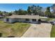 Charming single-story home featuring a well-maintained lawn and a carport, providing ample parking space at 4420 101St W St, Bradenton, FL 34210
