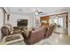 Relaxing living room with comfortable seating and an open view of the dining area at 4420 101St W St, Bradenton, FL 34210