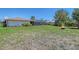 Expansive backyard with lush greenery, offering a serene escape and space for recreation at 4609 Talbot Pl, Sarasota, FL 34241