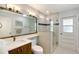 Well-lit bathroom featuring a single vanity, toilet, and a stylish glass-enclosed shower at 4609 Talbot Pl, Sarasota, FL 34241