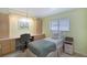 Cozy bedroom featuring built-in desk, storage cabinets, and a comfortable single bed at 4609 Talbot Pl, Sarasota, FL 34241