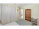 Bedroom showcasing a large closet, bookcase, and connecting door to the en-suite bathroom at 4609 Talbot Pl, Sarasota, FL 34241