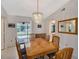 Formal dining area with view of screened lanai and pool at 4609 Talbot Pl, Sarasota, FL 34241