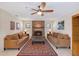 Relaxing living room with a brick fireplace, large rug and a cozy seating area at 4609 Talbot Pl, Sarasota, FL 34241