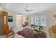 Open-concept living space with tile flooring, a ceiling fan, and an array of furnishings for a comfortable ambiance at 4609 Talbot Pl, Sarasota, FL 34241