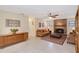 Inviting living room features a brick fireplace, neutral tones, and tile flooring at 4609 Talbot Pl, Sarasota, FL 34241