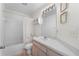 Bright bathroom with a tub and shower combination, vanity, and ample lighting at 4610 Runabout Way, Bradenton, FL 34203