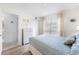 Cozy bedroom featuring a comfortable bed, dresser, closet, and natural light at 4610 Runabout Way, Bradenton, FL 34203