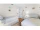 Comfortable bedroom featuring two beds, light colors, and closet at 4610 Runabout Way, Bradenton, FL 34203