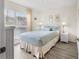 Relaxing bedroom with large window, ample natural light, and comfortable decor creating a cozy retreat at 4610 Runabout Way, Bradenton, FL 34203