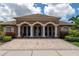 Welcoming clubhouse featuring elegant architecture, manicured landscaping, and a paved entrance at 4610 Runabout Way, Bradenton, FL 34203