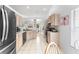 Spacious kitchen featuring bright cabinets, stainless steel appliances, and an open layout at 4610 Runabout Way, Bradenton, FL 34203