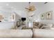 Open living area with neutral tones, tile flooring, and a seamless flow to other rooms at 4610 Runabout Way, Bradenton, FL 34203