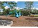 Community playground featuring slides, climbing structures, and soft mulch ground cover for safety at 4610 Runabout Way, Bradenton, FL 34203