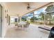 Inviting screened porch with comfortable seating and views of the surrounding landscape at 4610 Runabout Way, Bradenton, FL 34203