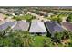 An aerial view of a well-maintained backyard and roof, capturing the surrounding landscape at 4814 Lake Breeze Ter, Sarasota, FL 34243
