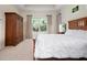 The bedroom is well lit and features a large wardrobe at 4814 Lake Breeze Ter, Sarasota, FL 34243