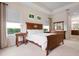 The bedroom is well lit and features wooden bedroom furniture at 4814 Lake Breeze Ter, Sarasota, FL 34243