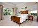 This bedroom is well lit, featuring large windows and light paint at 4814 Lake Breeze Ter, Sarasota, FL 34243
