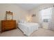 Bright bedroom with neutral tones and classic decor at 4814 Lake Breeze Ter, Sarasota, FL 34243