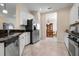 Spacious kitchen with stainless steel appliances and seamless flow to the dining area at 4814 Lake Breeze Ter, Sarasota, FL 34243