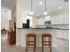 Kitchen view with seating area and granite countertops at 4814 Lake Breeze Ter, Sarasota, FL 34243