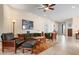Comfortable living room featuring tile floors, neutral walls, and wood furniture accents at 4814 Lake Breeze Ter, Sarasota, FL 34243