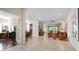 Bright and spacious living area with tile flooring and views into other rooms at 4814 Lake Breeze Ter, Sarasota, FL 34243