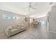 Living room with natural light, modern furniture, decorative lighting, and view of dining area at 4838 San Ortebello Dr, Bradenton, FL 34208