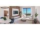Inviting living room with balcony access, complemented by stylish furnishings and a modern entertainment center at 4950 Remington Dr # 114, Sarasota, FL 34234