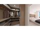 Well-organized walk-in closet with custom shelving and storage solutions, adjacent to a serene bedroom at 4950 Remington Dr # 114, Sarasota, FL 34234