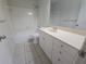 Bathroom features a shower-tub combo, tile floors, and a vanity with storage at 5002 26Th Avenue Dr E, Palmetto, FL 34221