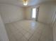 Bedroom has tile flooring, neutral paint and ceiling fan at 5002 26Th Avenue Dr E, Palmetto, FL 34221