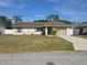 Charming single-story home with a well-maintained lawn and a cozy, inviting facade at 5002 26Th Avenue Dr E, Palmetto, FL 34221