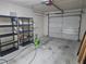 Garage featuring shelving for storage and a power washer at 5002 26Th Avenue Dr E, Palmetto, FL 34221