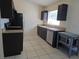 Updated kitchen featuring stainless steel appliances, granite countertops, and dark wood cabinets at 5002 26Th Avenue Dr E, Palmetto, FL 34221