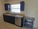 Updated kitchen features granite countertops and stainless steel dishwasher at 5002 26Th Avenue Dr E, Palmetto, FL 34221