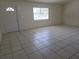 Spacious living room with neutral paint and tile floors at 5002 26Th Avenue Dr E, Palmetto, FL 34221