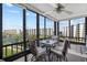 Relax on this inviting balcony with seating and views of the landscape at 5780 Midnight Pass Rd # 410, Sarasota, FL 34242