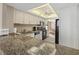 Kitchen with light-toned cabinetry, tile backsplash, granite countertops, and black appliances at 5780 Midnight Pass Rd # 410, Sarasota, FL 34242