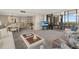 Living room with a dining area, television and sliding glass doors to a patio at 5780 Midnight Pass Rd # 410, Sarasota, FL 34242