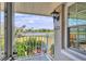 Balcony with scenic water view, white railings, and charming seating arrangement at 623 Estuary Dr, Bradenton, FL 34209