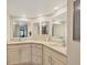 Bright bathroom with double sinks, granite countertops, and neutral cabinets at 623 Estuary Dr, Bradenton, FL 34209