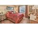 Cozy bedroom with a decorative bedspread and warm lighting at 623 Estuary Dr, Bradenton, FL 34209