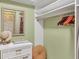 Walk-in closet with shelving and ample space for organization at 623 Estuary Dr, Bradenton, FL 34209